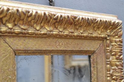 null Carved and gilded wood frame with rais-de-coeur decoration, the plate with rare...