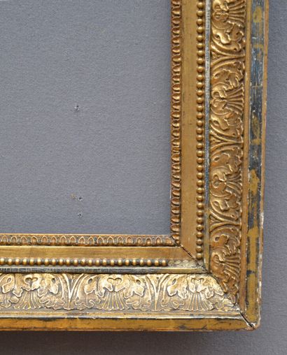 null Gilded wood and paste frame decorated with rais-de-coeur, pearl friezes and...