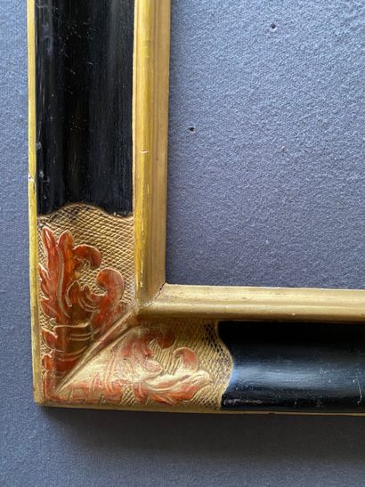 null Blackened and gilded moulded wood frame, the corners decorated with large acanthus...