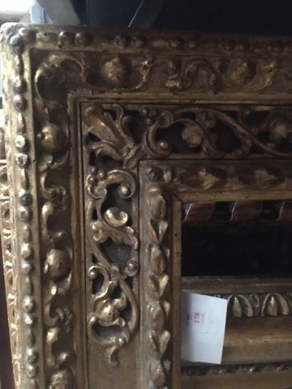 null Large carved and gilded limewood frame with laurel twists, foliage scrolls in...