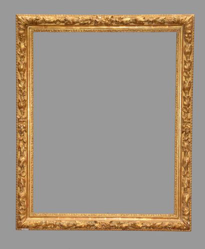 Wood and gilded stucco frame decorated with...