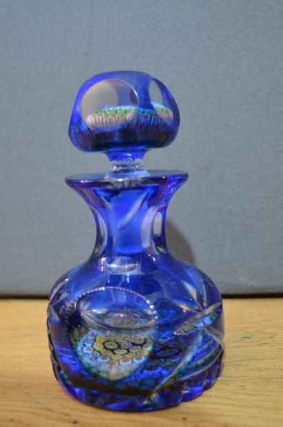 null Blue crystal overlay flask with globular body and cut sides, the stopper and...