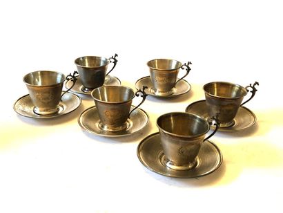 null Suite de six TASSES à café et sous tasses en argent, le fond guilloché et les...