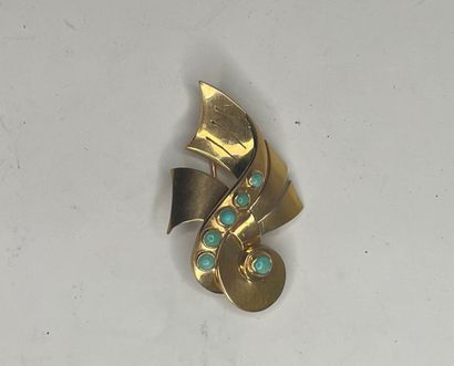 null Broche en or jaune (750) de forme mouvementée sertie de petits cabochons turquoise.

Poids...