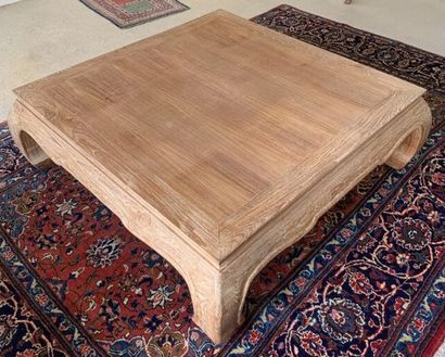null Coffee table in ceruse oak, the belt scalloped, resting on four curved legs....