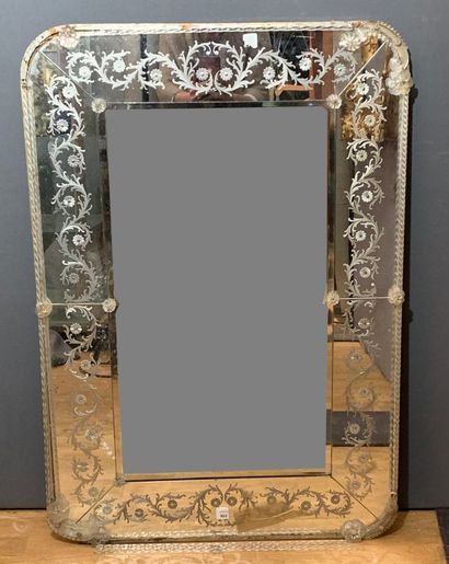 null Mirror with glass bezels engraved with foliage, flowers and twisted rods. 

Murano,...