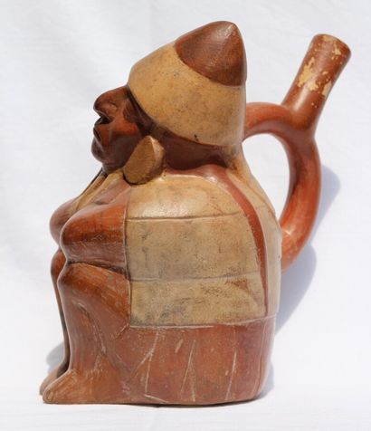 null Stirrup-handled vase representing a sleeping dignitary.

Seated with his legs...