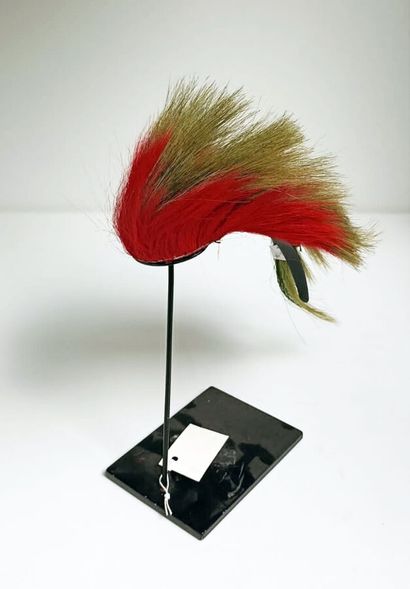 null Small ROACH in green and war red dyed porcupine hair on a finely braided wool...