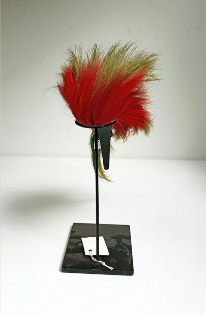 null Small ROACH in green and war red dyed porcupine hair on a finely braided wool...
