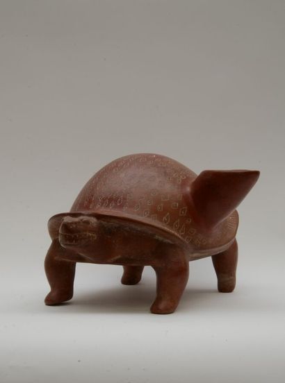 null Vase representing a turtle. The neck emerges on one of the sides of the shell...