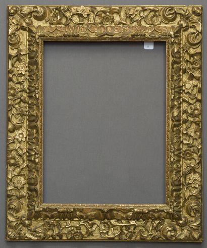 null Frame with reversed profile in molded wood, carved, decorated with frieze of...