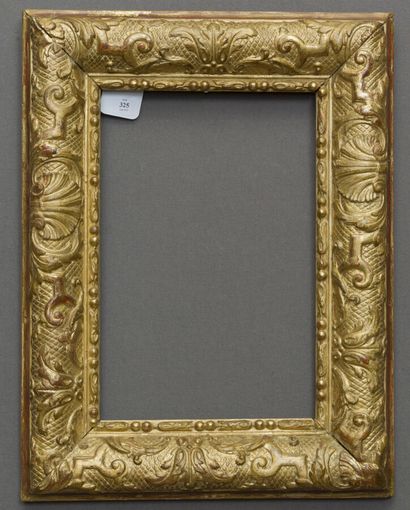 null Frame in molded wood, carved and gilded with friezes of rosaries and decoration...