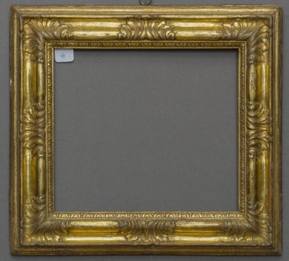 null Frame with reversed profile in molded wood, carved, gilded, decorated with friezes...
