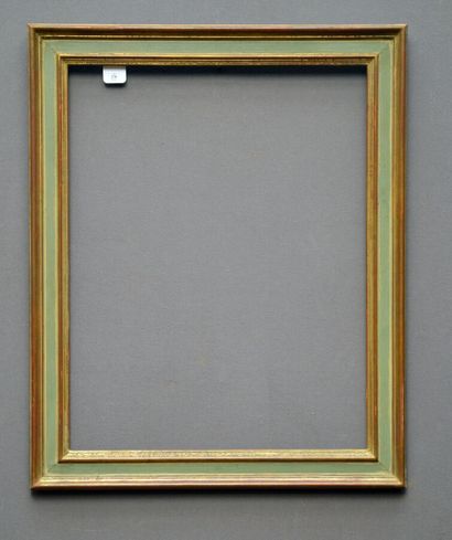 null Frame in molded wood, gilded and rechampi green water. 

XXth

Dim : 67.5 x...