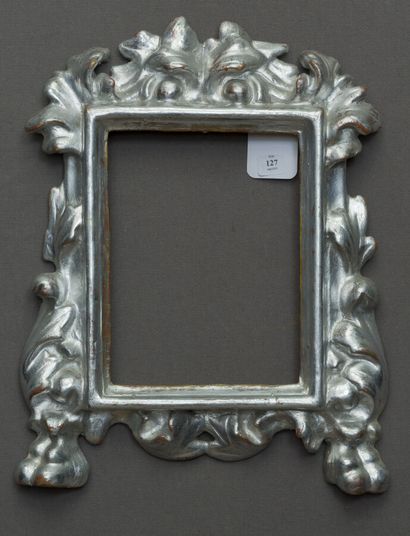 null Small carved and silvered wooden FRAME decorated with a pediment with a leafy...