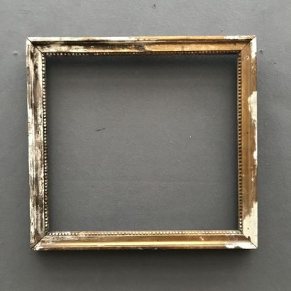 null Lot of three FRAMES including : 

- A carved and gilded wood baguette frame,
54,5...