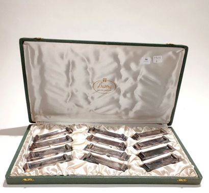 null BARRA 
Set of 12 knife holders in silver plated metal.
In a case lined with...