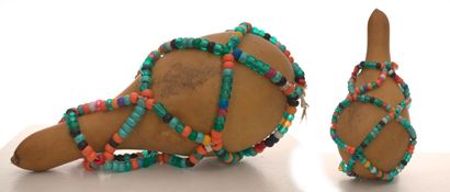 null Asson 

Vodou ritual object composed of a calabash and glass beads, 25 cm

25...