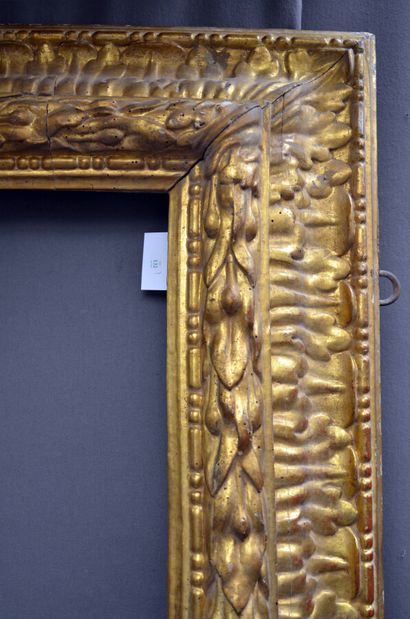 null Large carved and gilded wood frame with friezes of rosaries, laurel twists and...