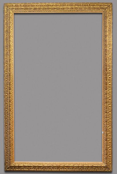 null LARGE FRAME 
with reversed profile in carved and gilded wood decorated with...
