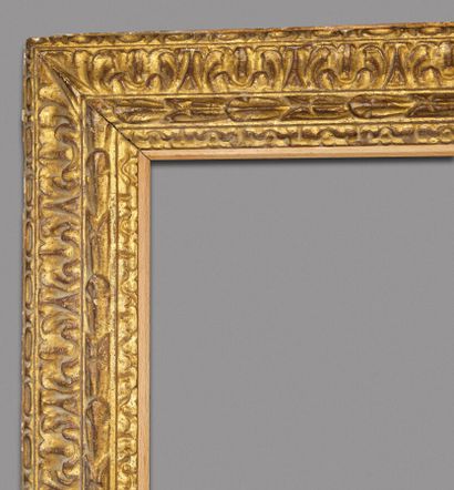 null LARGE FRAME 
with reversed profile in carved and gilded wood decorated with...