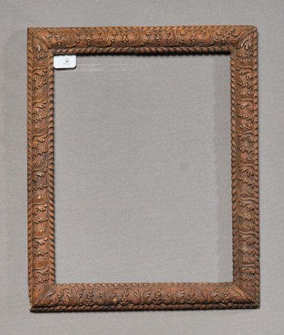 Frame in patinated oak decorated with frieze...