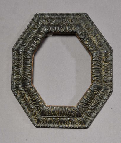 null Frame with reversed profile of octagonal form out of moulded, carved and blackened...