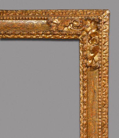 null Large carved and gilded wood frame with frieze of water leaves, laurels, leafy...