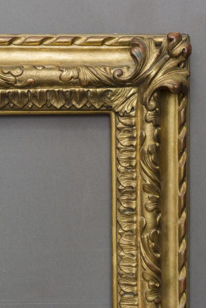 null FRAME 
with reversed profile in molded, carved and gilded wood decorated with...