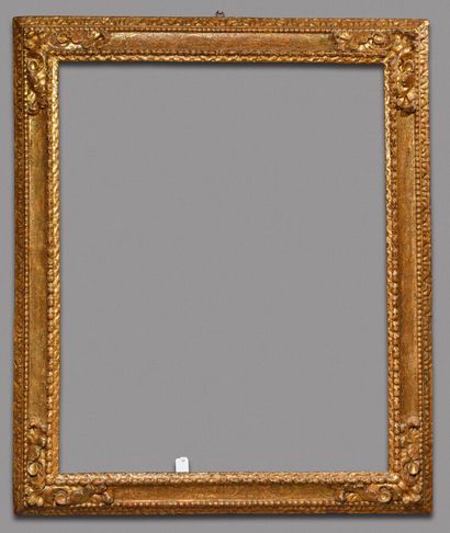 null Large carved and gilded wood frame with frieze of water leaves, laurels, leafy...