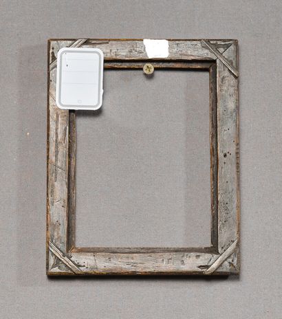 null Small gilded wood frame carved with a frieze of water leaves and twisted ribbons.
Louis...