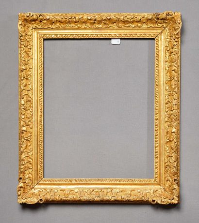 null Gilded molded oak frame carved with a frieze of watered gadroons and scrolls...