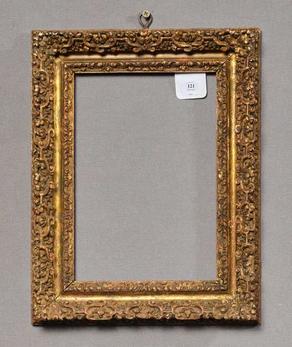 null Frame in molded wood, carved and gilded with friezes of water leaves and decoration...