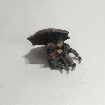 null VIENNA BRONZE polychrome representing a monkey and a man under an umbrella,...