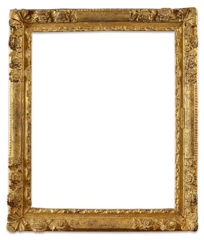 FRAME 
in molded and carved wood, gilded...