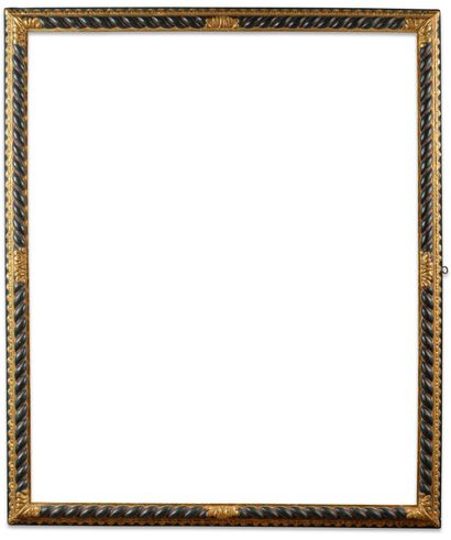 FRAME 
in carved wood, gilded and blackened...