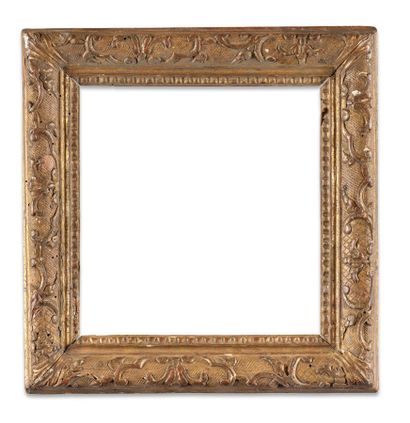 FRAME 
in carved and gilded oak with a Bérain...