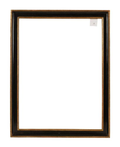 Frame in carved, blackened and gilded wood,...