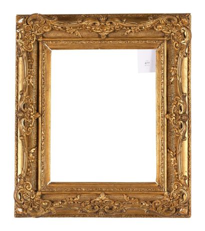 Gilded stucco and wood frame decorated with...