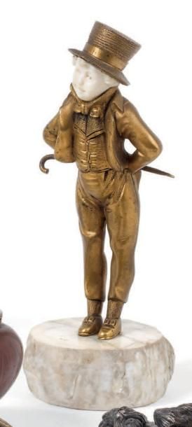 Georges OMERTH (Actif 1895 - 1925) Statuette en bronze doré et ivoire figurant un...