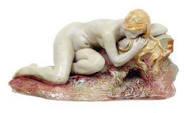 EMILE MULLER (1823-1889) Jeune femme nue allongée Grès émaillé polychrome, signé...