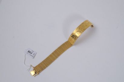 null BIJ008 - BRACELET en or jaune composé d'une partie rigide gravée de rinceaux...