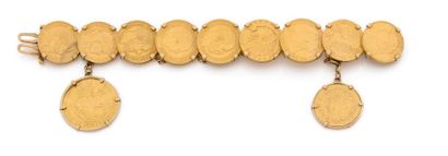 null BRACELET à maillons composées de 11 pièces en or (louis, souverain, 5$, reichmark…)...