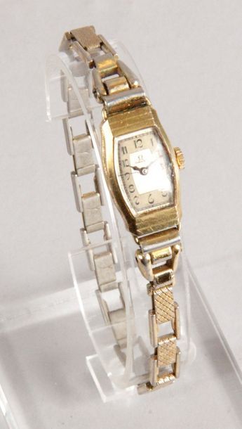 OMEGA MONTRE DE DAME en or jaune des années 1930. Bracelet extensible en acier et...