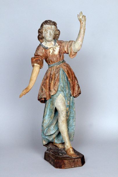 FRANCE, début XVIIe siècle STATUETTE D'ANGELOT en bois sculpté polychrome.
(Socle...
