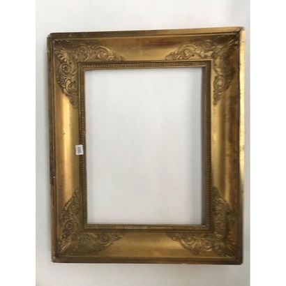 null EMPIRE FRAME in wood and gilded stucco with palmette decoration and stylized...