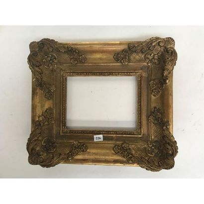 null STYLE REGENCY FRAME in gilded wood with shells, foliage and garlands of flowers...