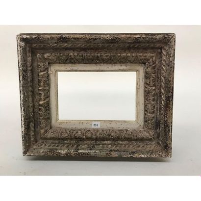 null FRAME in patinated wood with a gadrooned and floral pattern. Circa 1940. Int....