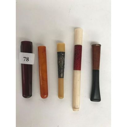 null 5 FUME-CIGARETTE, 2 in amber, 1 in horn mounted in silver, 1 in ivory and shagreen...