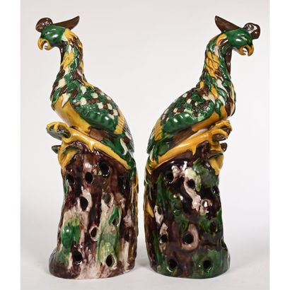 null PAIR OF GLazed ceramic SUBJECTS in shades of yellow, green and brown depicting...